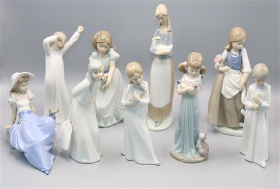 Lladro model of a girl with a puppy and 8 Nao figures of young girls, various